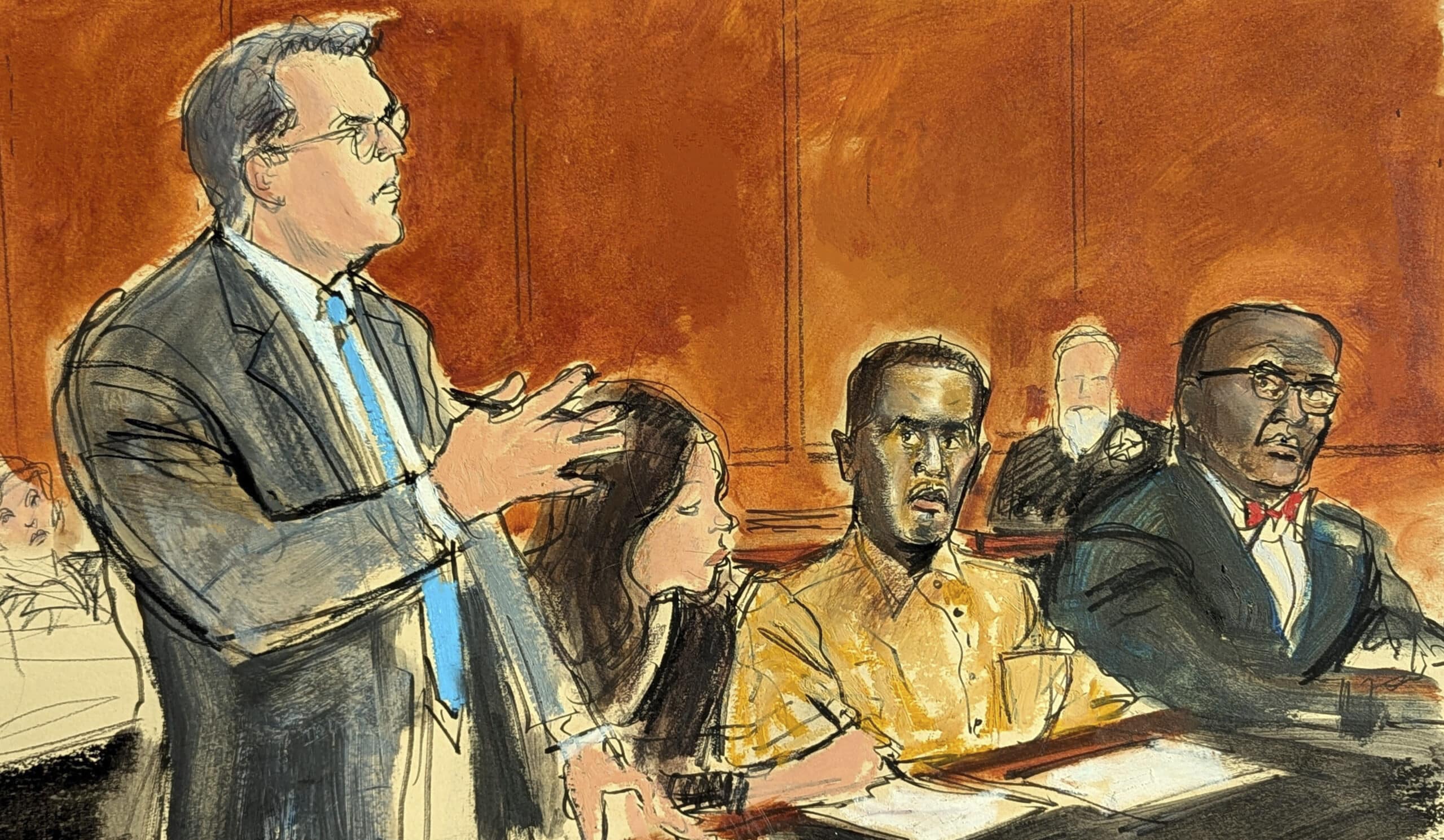 Sean "Diddy" Combs (second from right) with defense lawyer (standing)